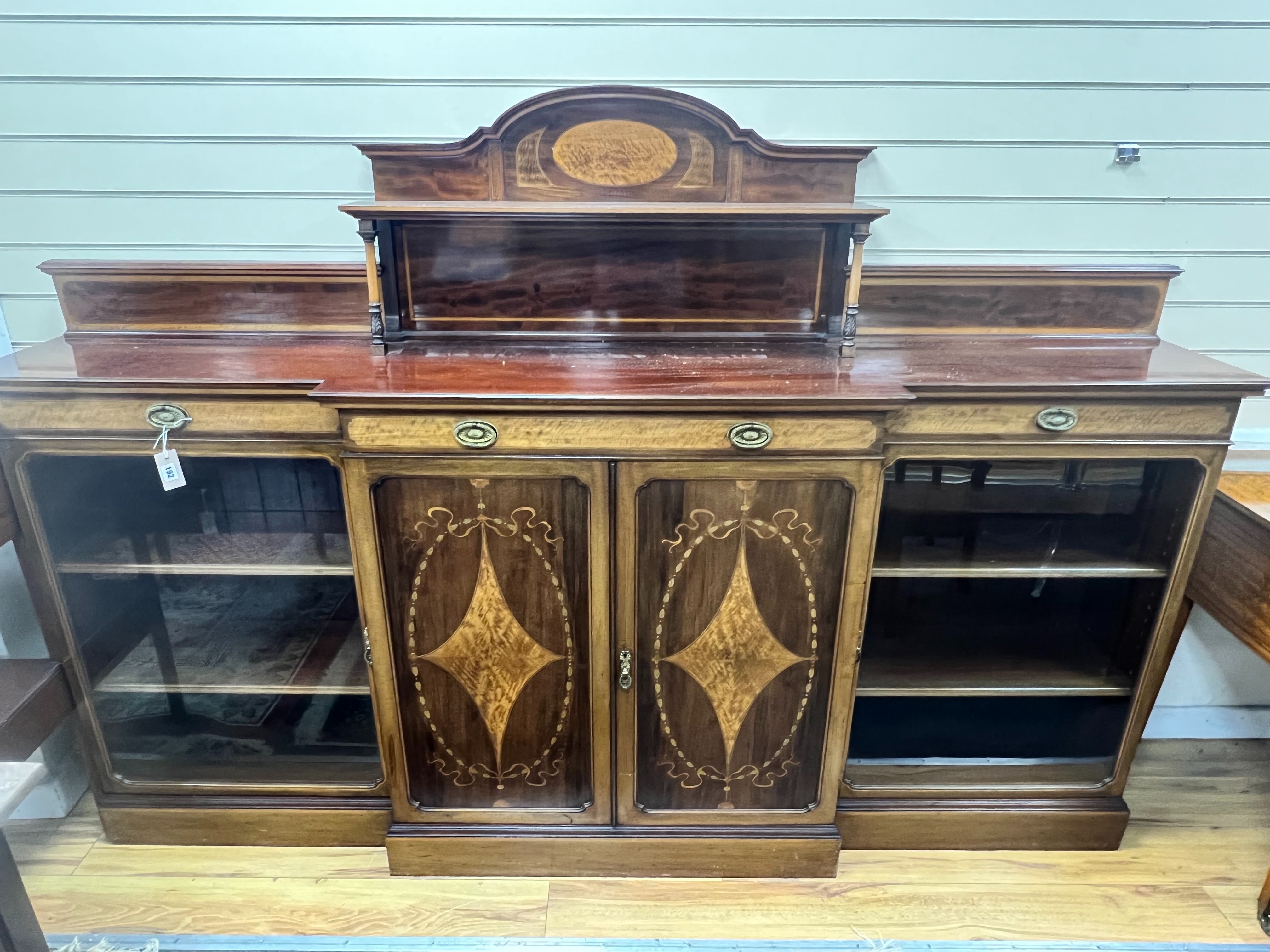 An Edwardian marquetry inlaid mahogany breakfront side cabinet, width 227cm depth 39cm height 155cm